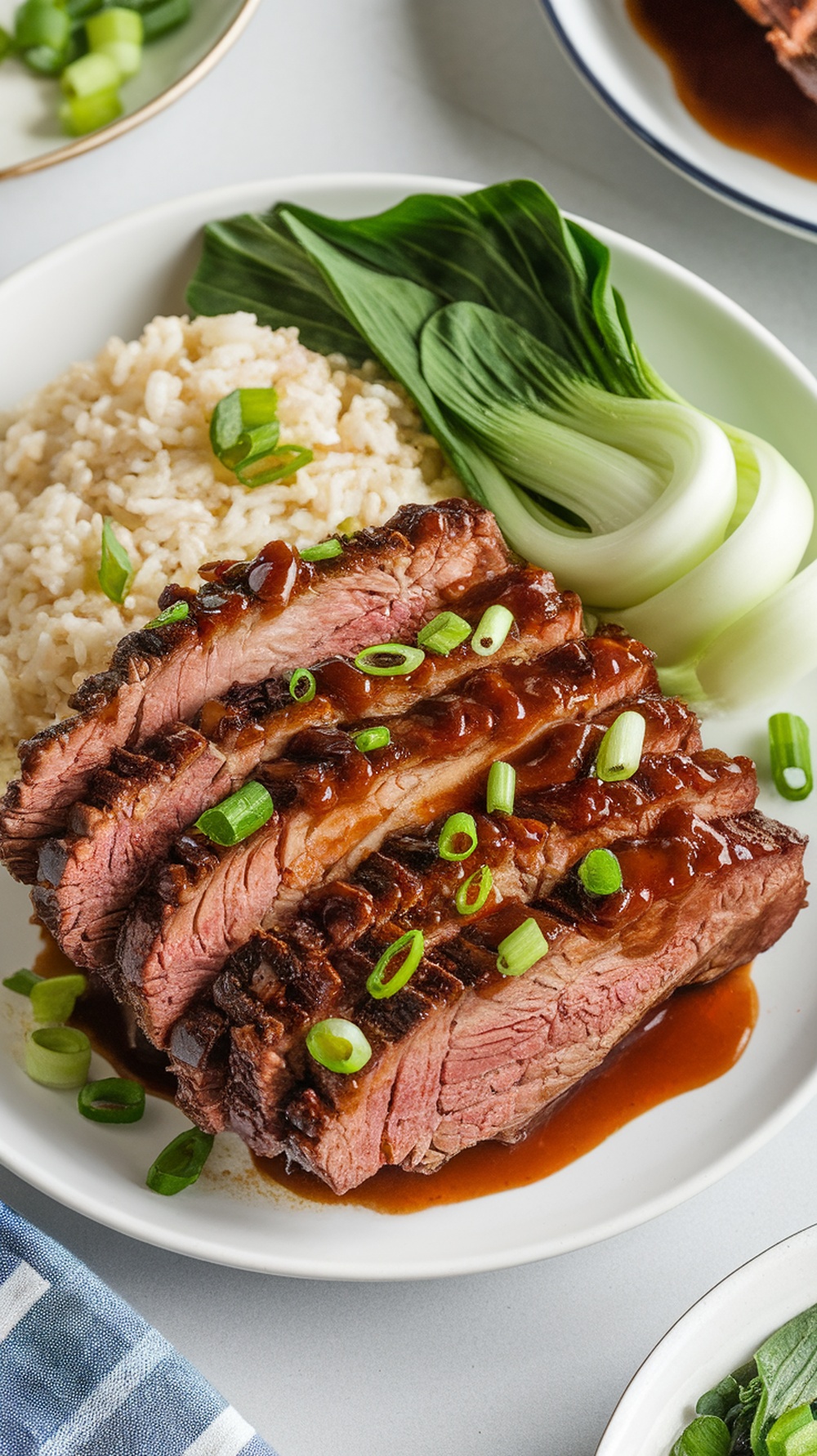 Asian-inspired brisket with hoisin sauce, served with rice and bok choy